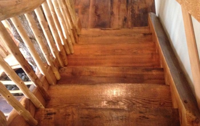 Custom Built Log Stair case in Log Home.